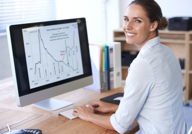 Portrait of a young businesswoman sitting her desk