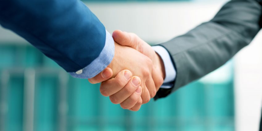 Business people shakeing hands, copy space
